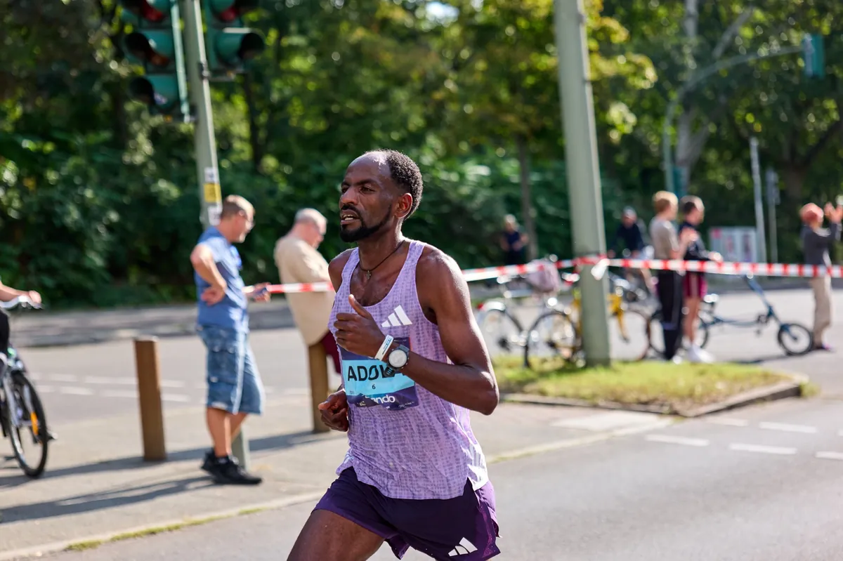 Guye Adola on the course of the Berlin Marathon, September 2025
